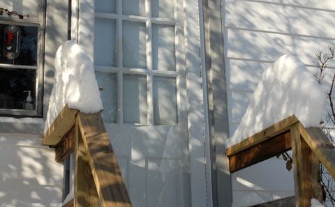 snow pile on the porch railing - 779