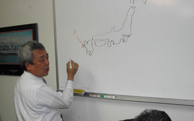 Prof Kijima shows location of Oshima shipyard and his university